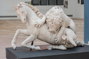 Lion attacking a horse